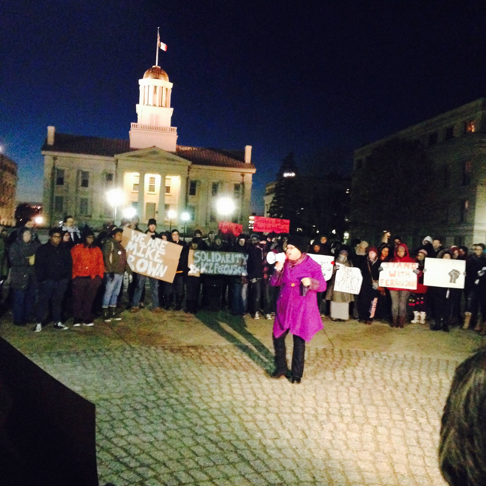 Image of letter author, Kendra Malone, holding a megaphone at a rally on the Pentacrest at the University of Iowa (2014)